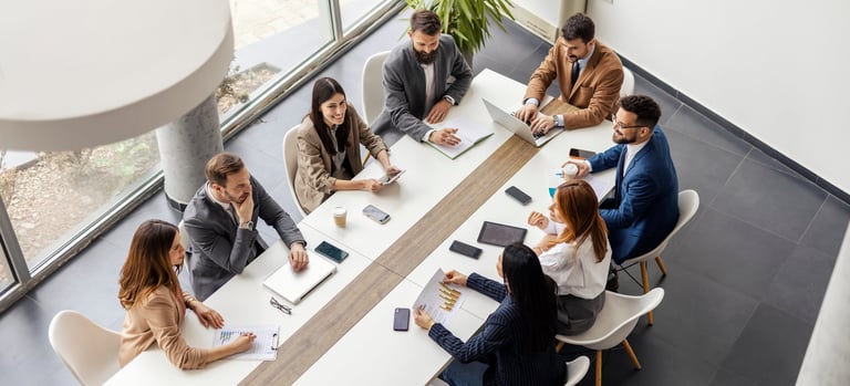 Team collaborating around conference table in modern office