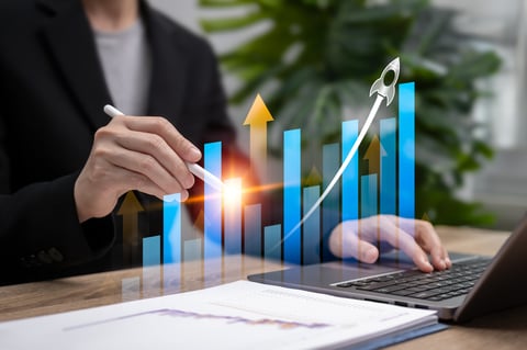 Businesswoman showing growth analytics graph